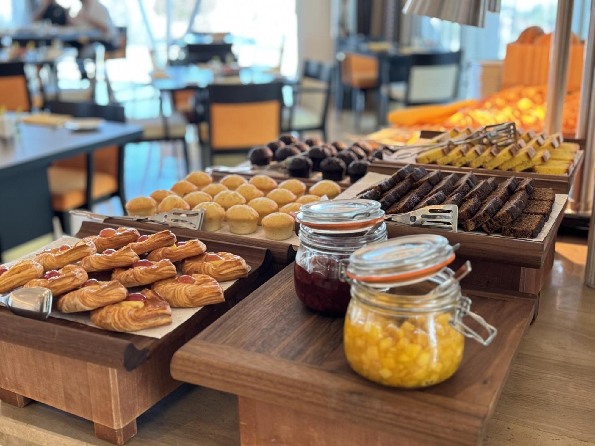 Shaza Doha Hotel Exterior photo A selection of pastries and jams at a buffet